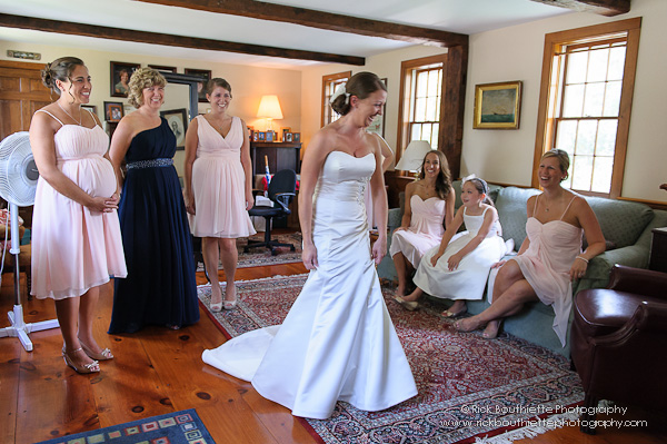 Bride takes spin in dress, laughing.