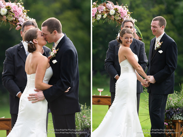 Bride & groom kiss at wedding ceremony