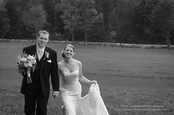 Bride & Groom walk in field