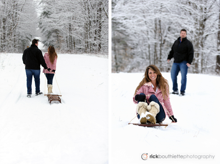 couple sledding in snow, engagement photography