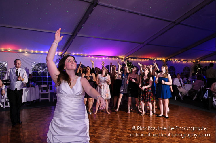 bride throwing bouquet