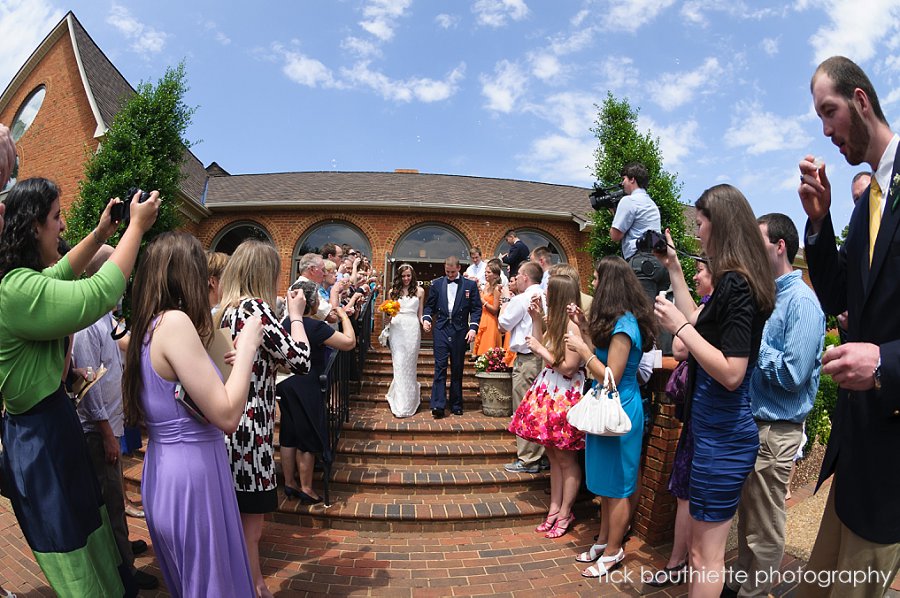 Bride and groom exit wedding reception