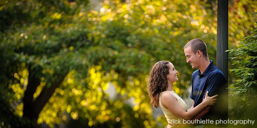 couple in warm sunlight during engagement photos