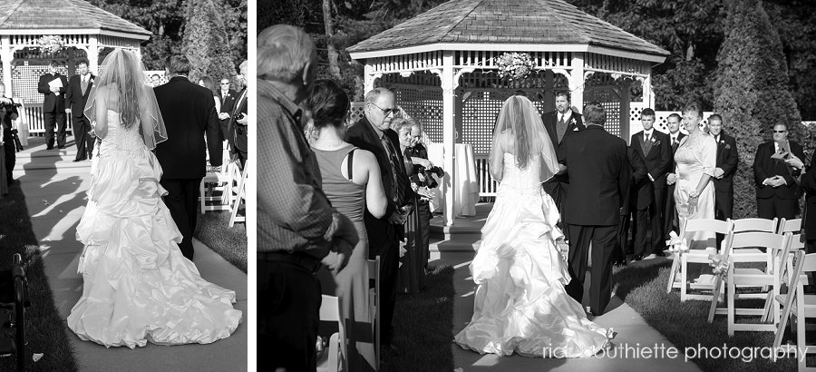 Bride walking down aisle, back od dress, at the executive court banquet facility