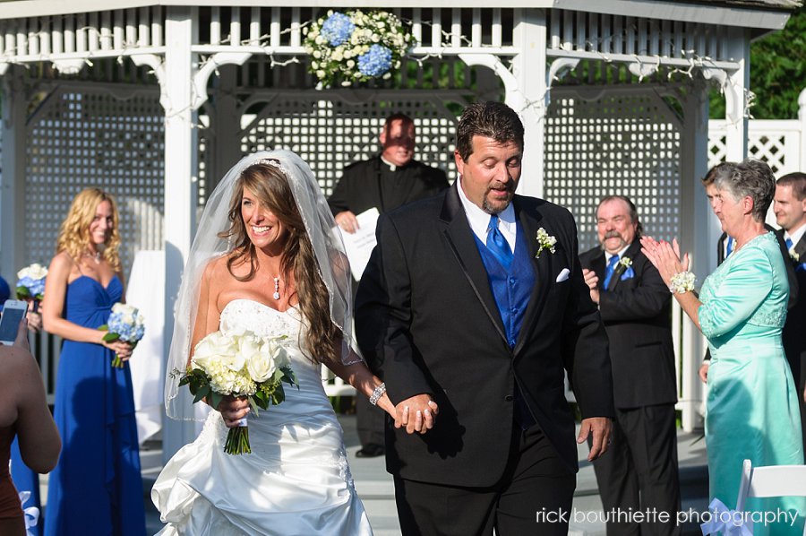 Bride & groom walk down aisle after wedding ceremoy at the executive court banquet facility