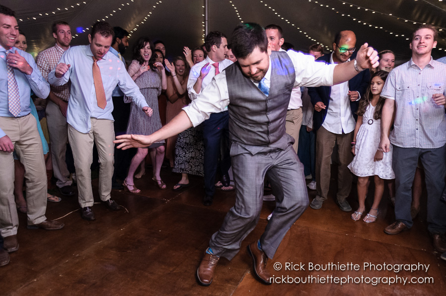 Groom dancing at wedding reception