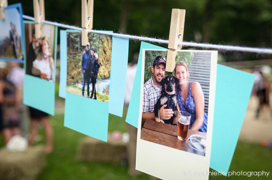 pictures hanging on clothesline at wedding