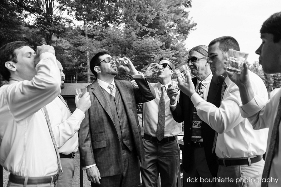 groom & groomsmen doing a shot of whiskey