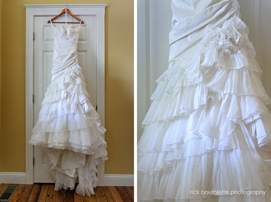 wedding gown hanging on door