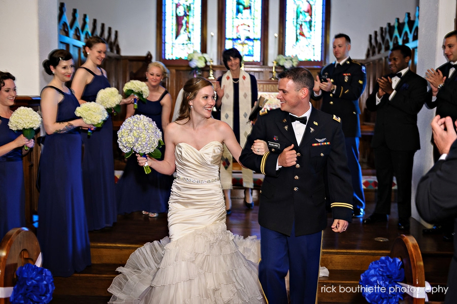 bride and groom walking down aisle after wedding ceremony