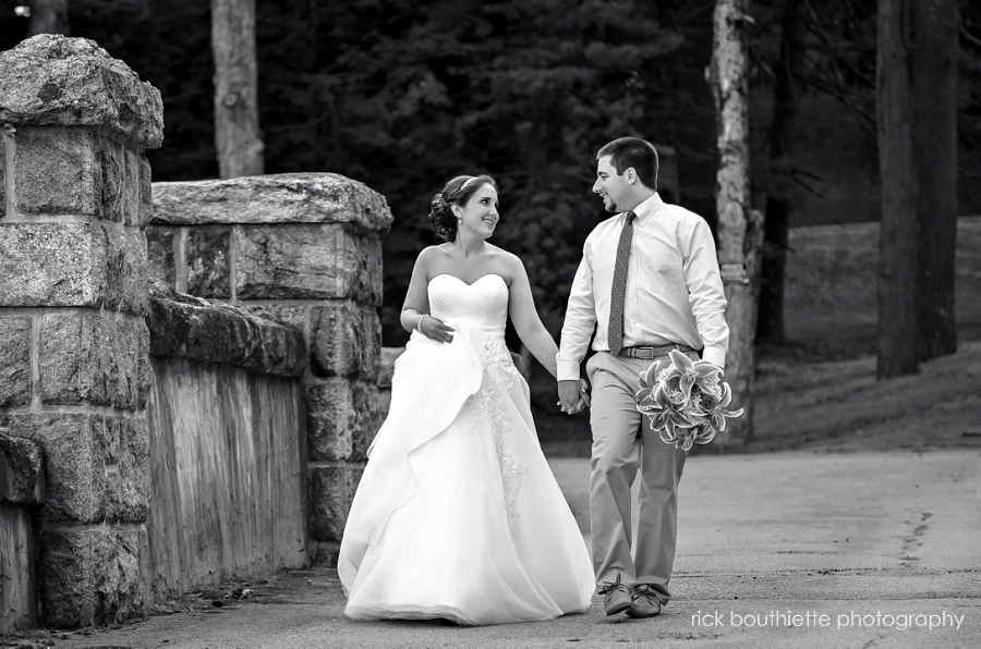bride & groom walking black & white
