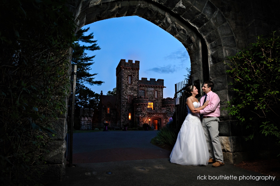 bride & groom with searles castle at night