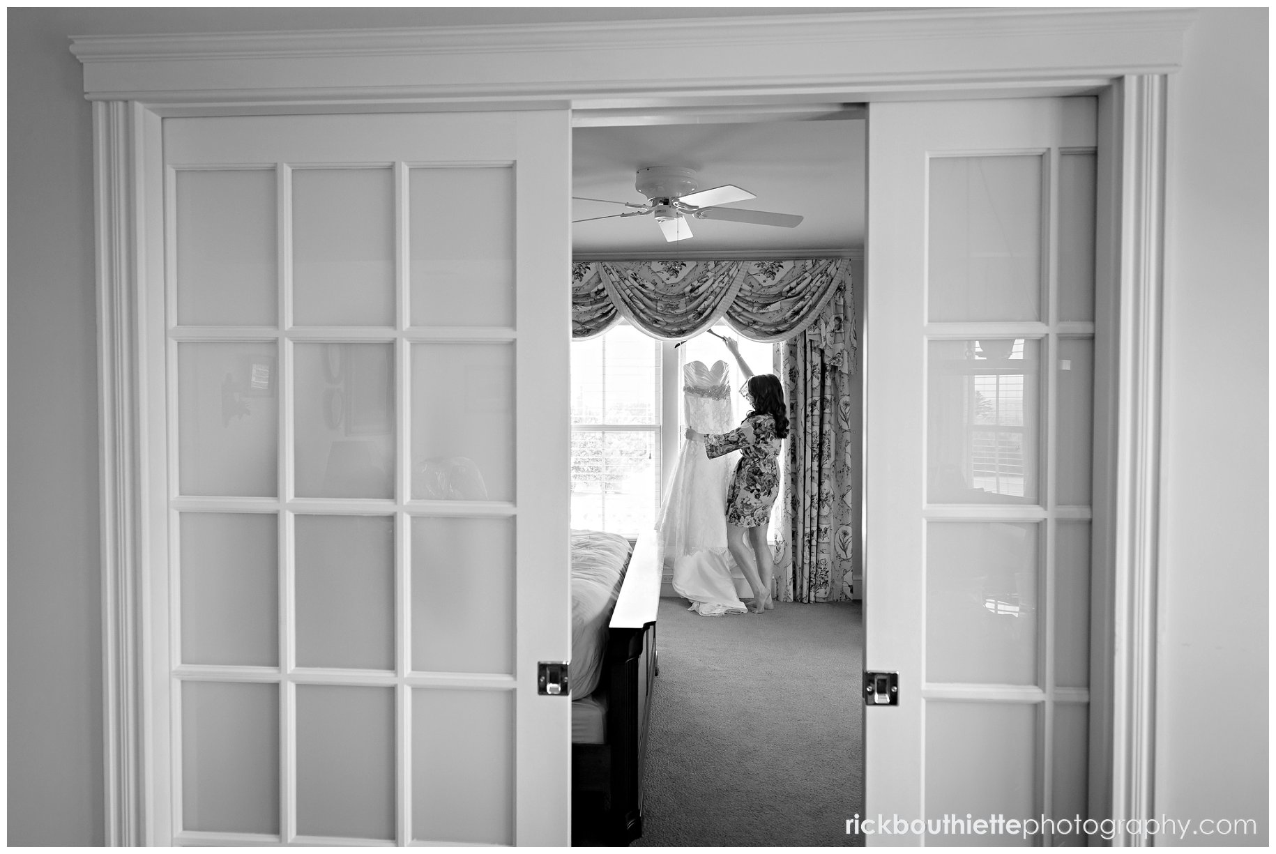 a peek in at the bride getting her wedding dress ready for her mountain view grand resort wedding
