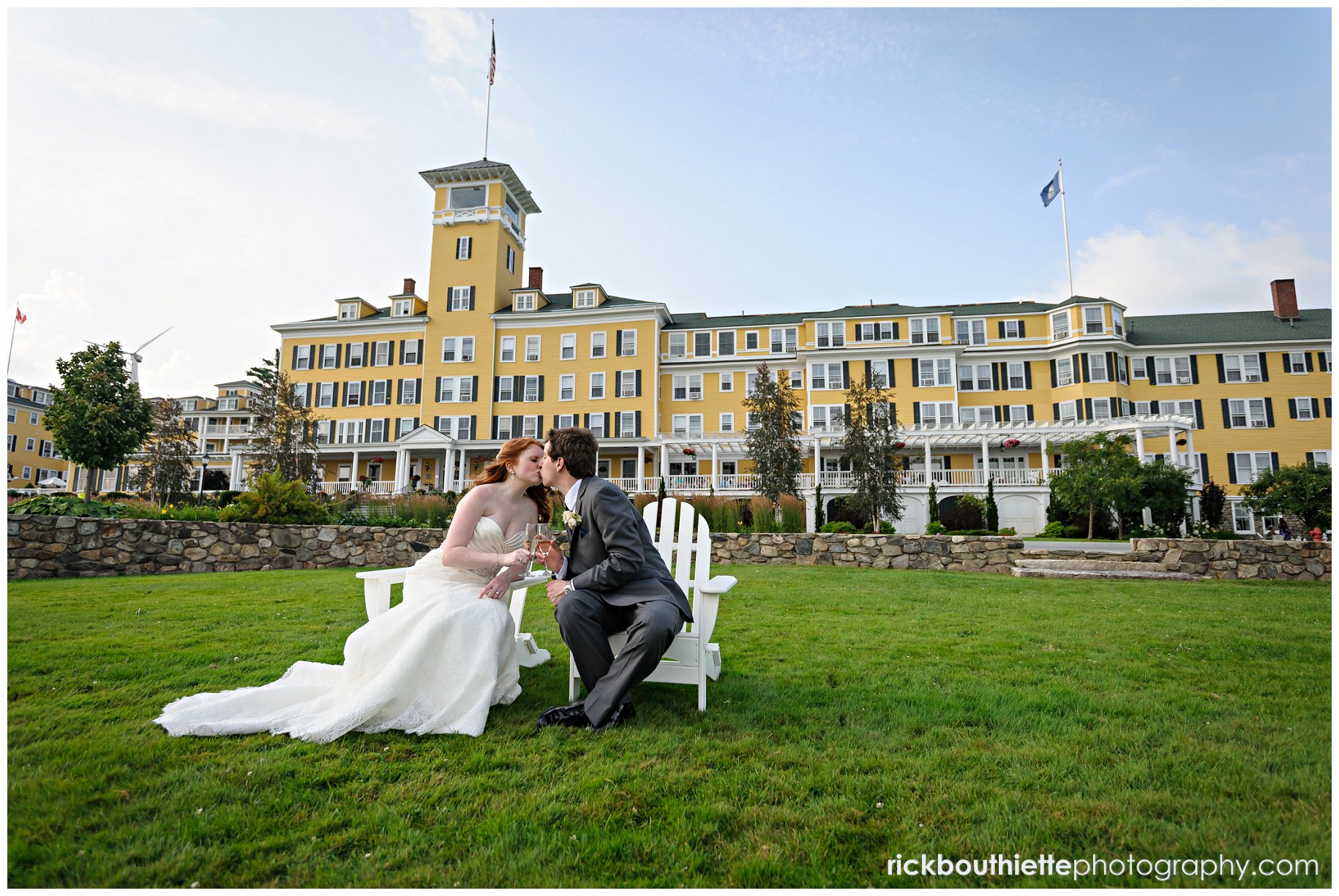 bride and groom enjoying a few moments in the adirondack chairs, Mountain View Grand in background