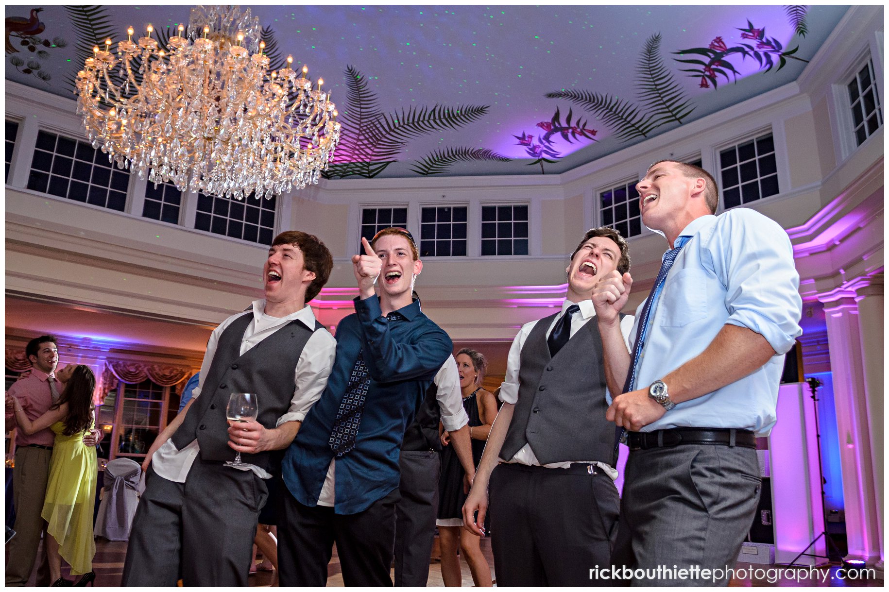 the groom and friends belting one out at wedding reception.