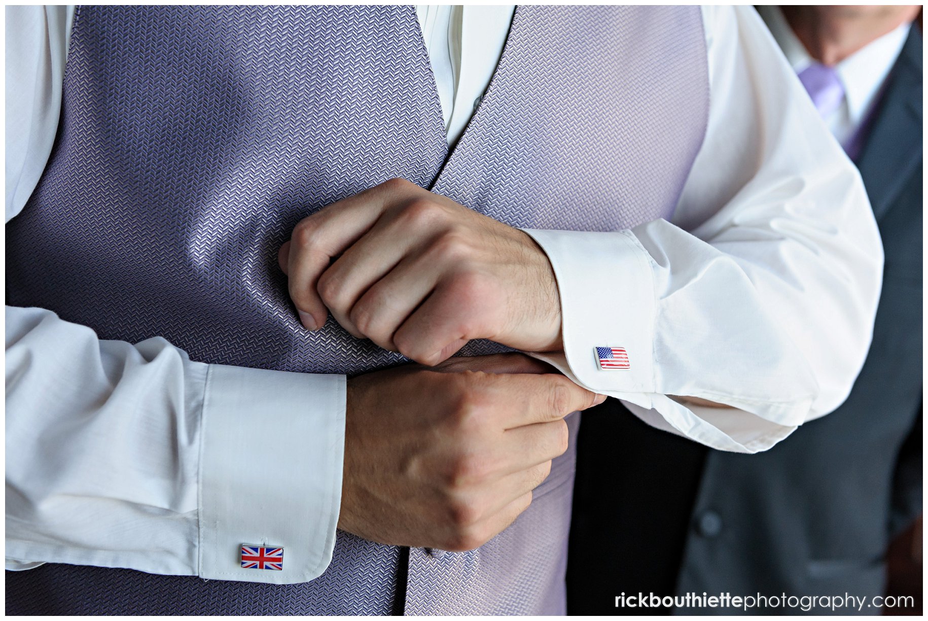 groom showing off his cufflinks