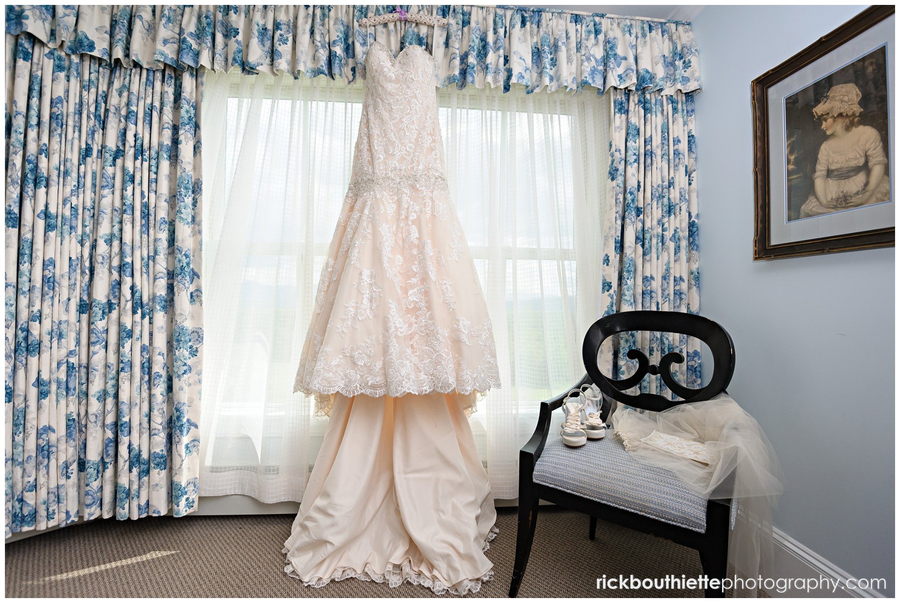 wedding dress hanging in window at Mountain View Grand