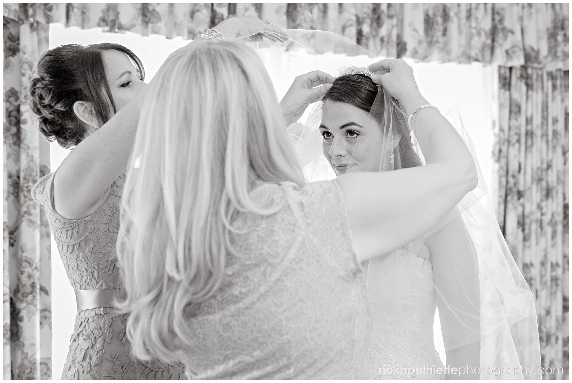 Moms adjusting the bride's viel