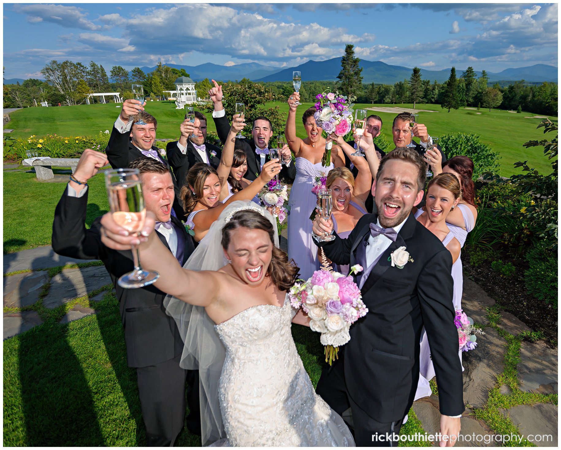 bride and groom celebrate with wedding party