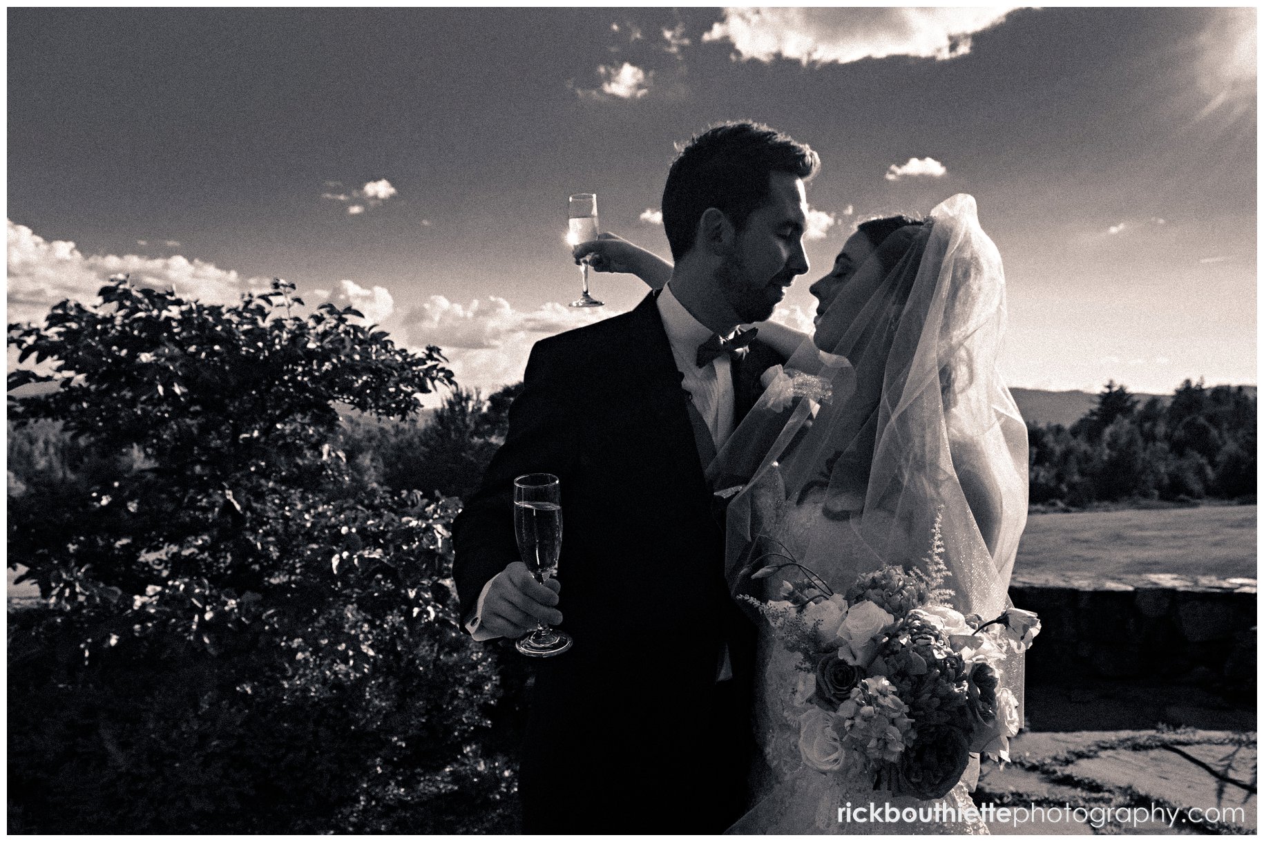 bride and groom with chanpagne in sillouette