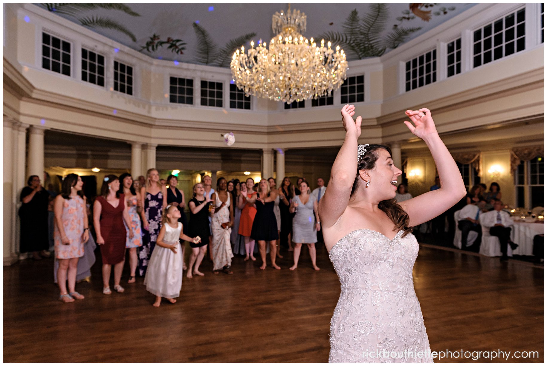 bride throwing bouquet