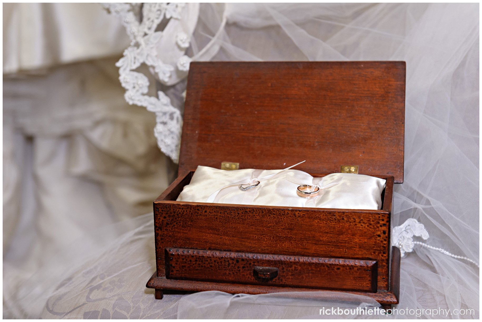 antique wooden family heirloom with wedding rings