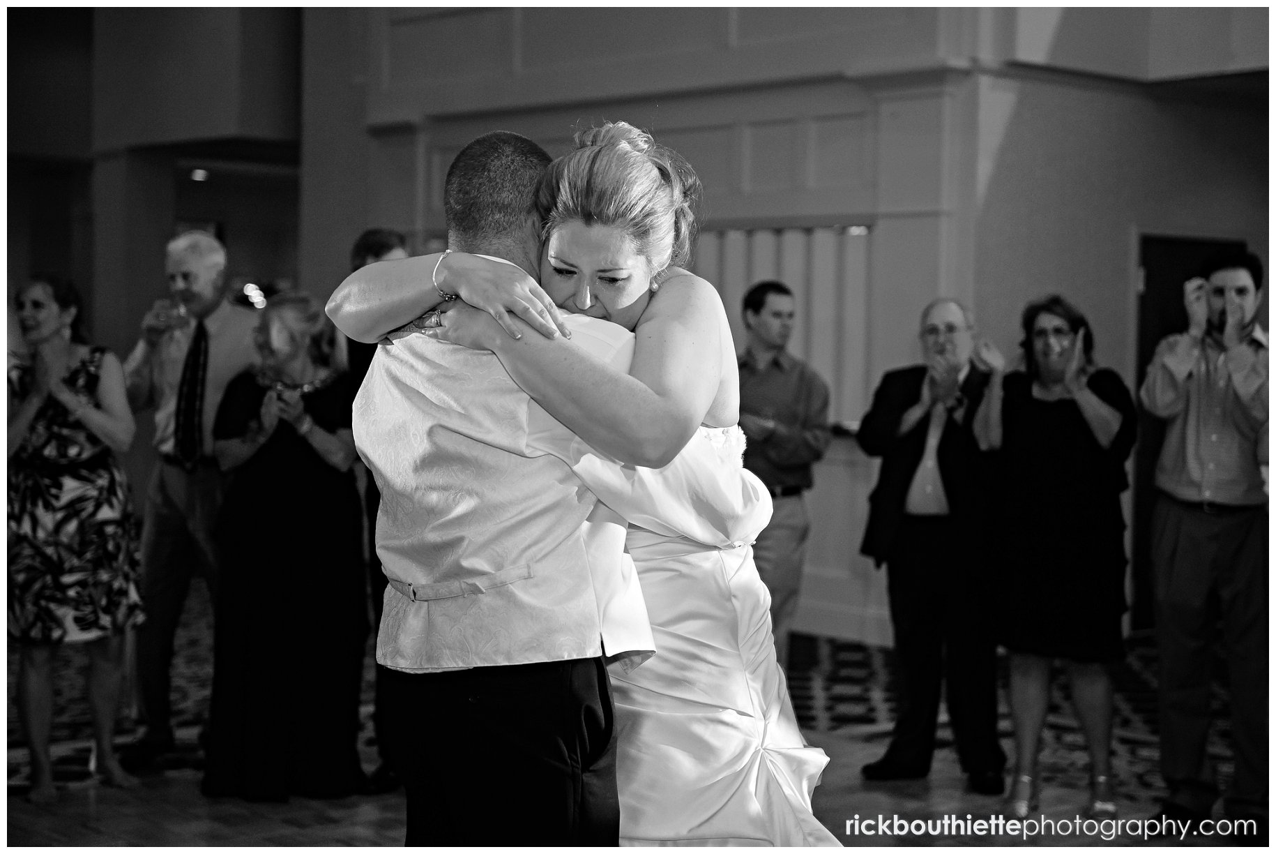 emotional embrace after last dance bride & groom first dance at Atkinson Country Club wedding