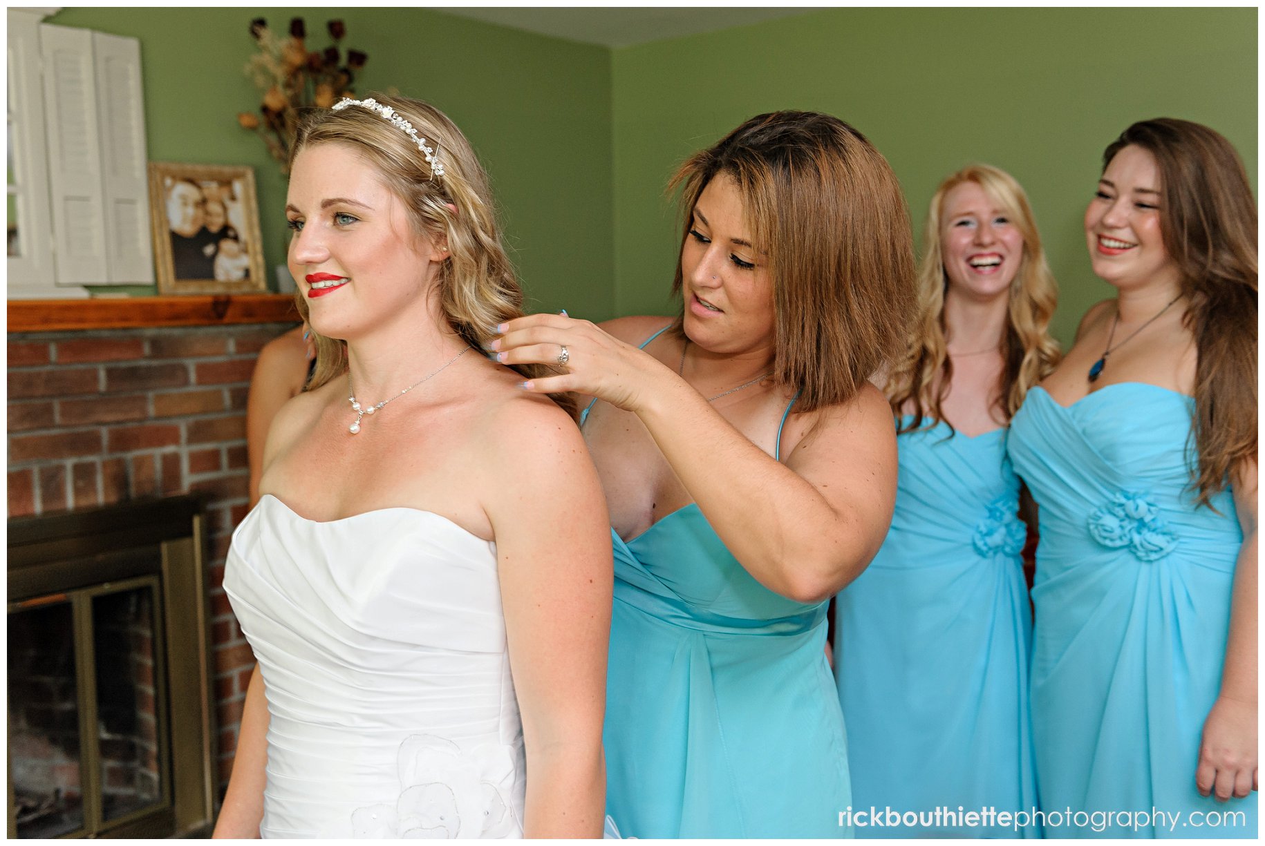 Bridesmaids helping bride prepare for wedding