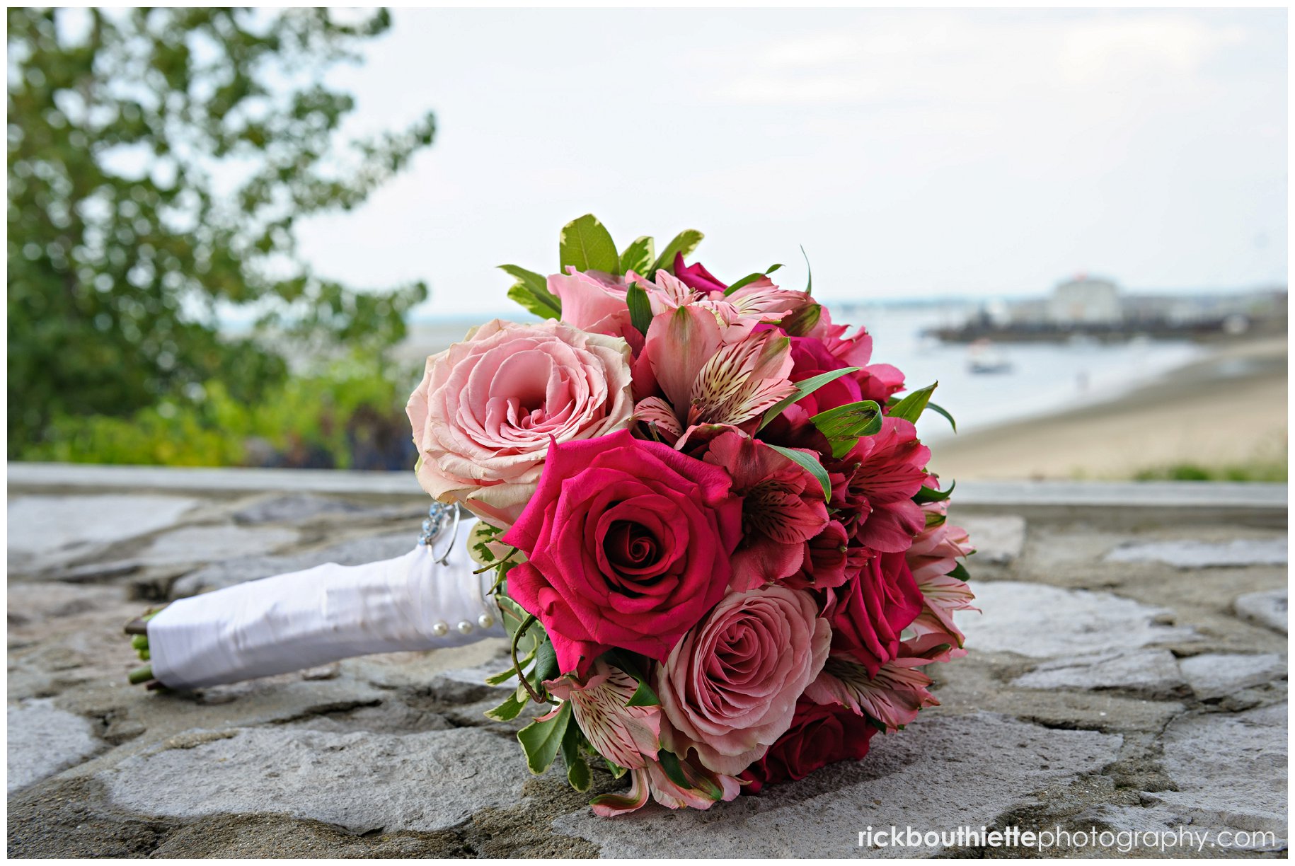 bride's bouquet on rocks with ocean in background