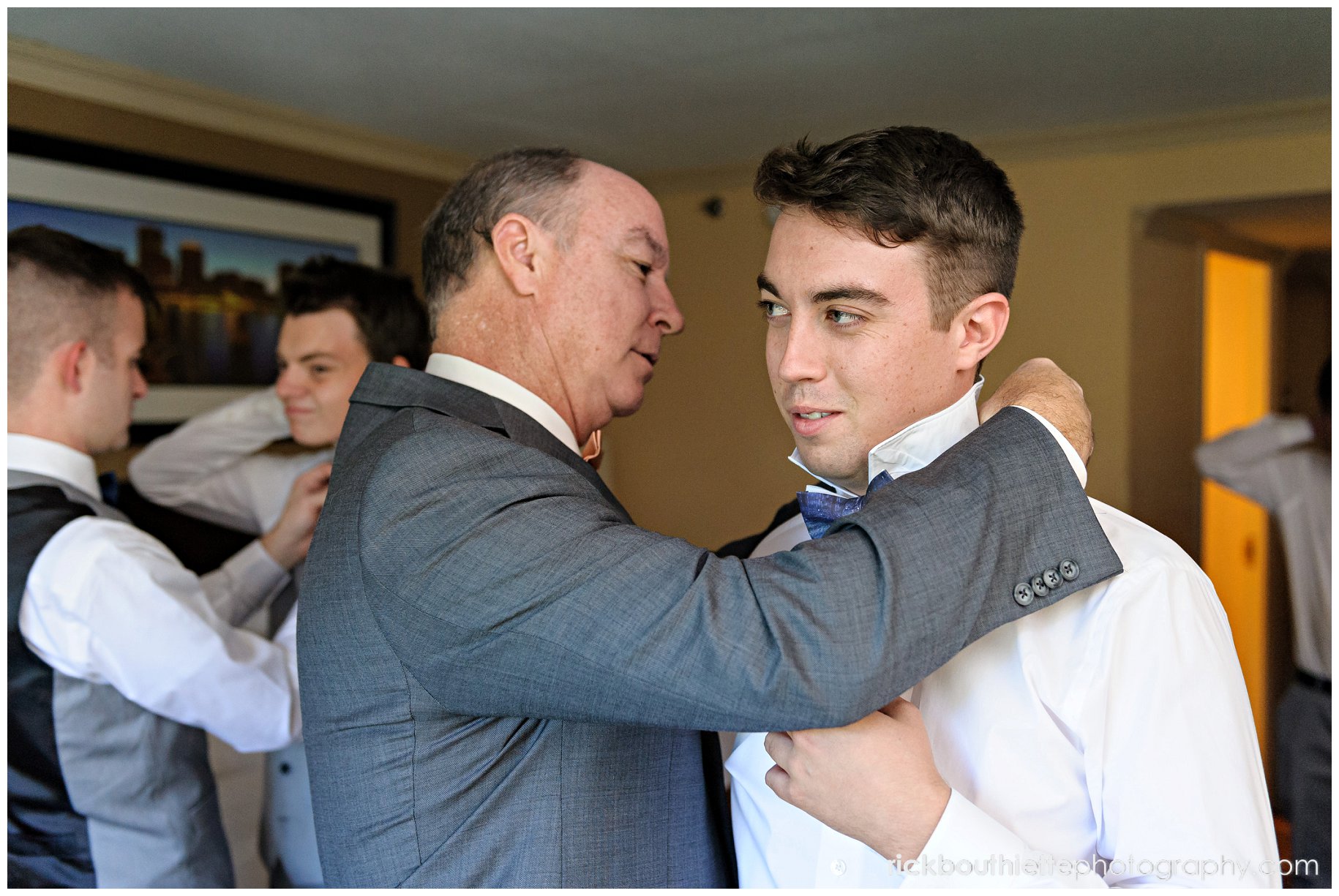 groom getting ready for wedding, Father helping with tie