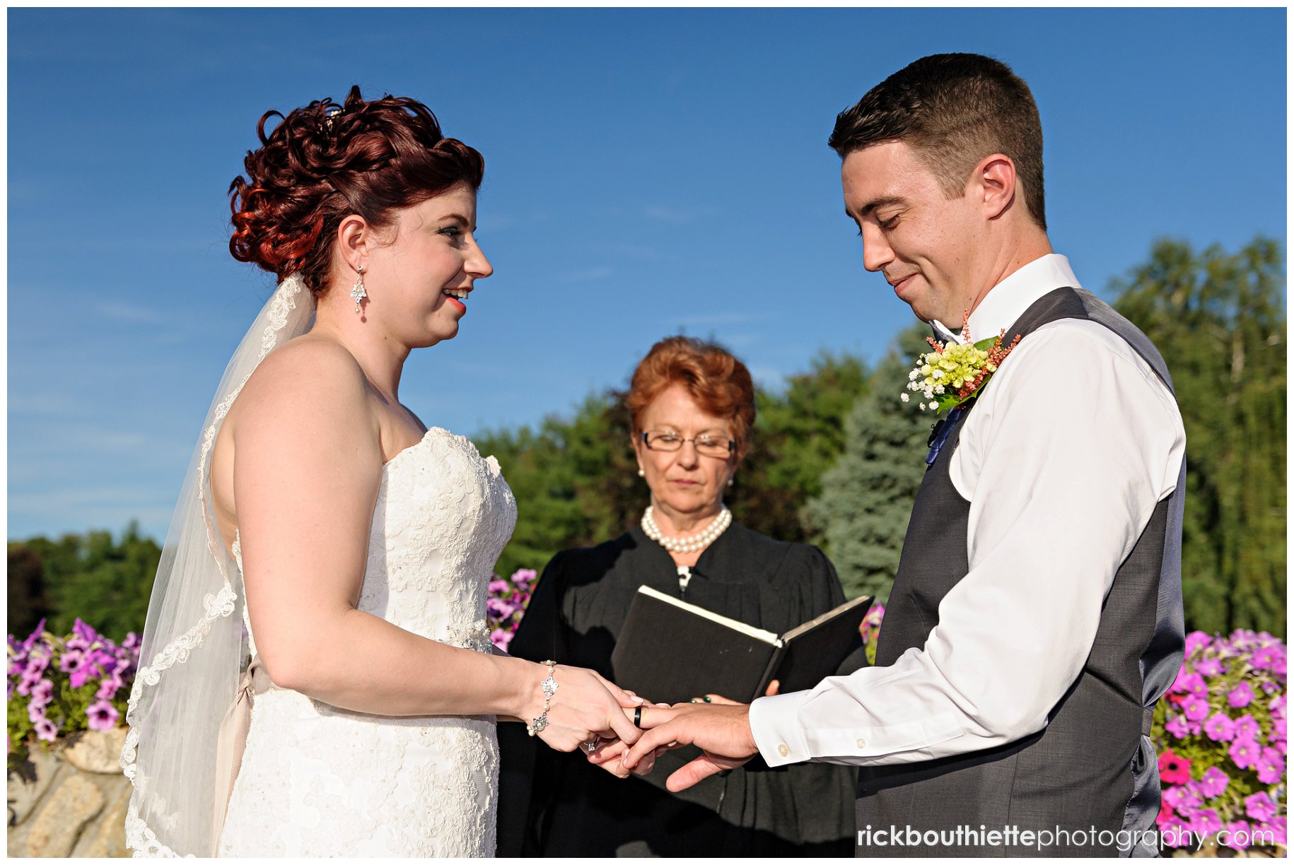 bride & groom echange rings at Tewksbury Country Club wedding