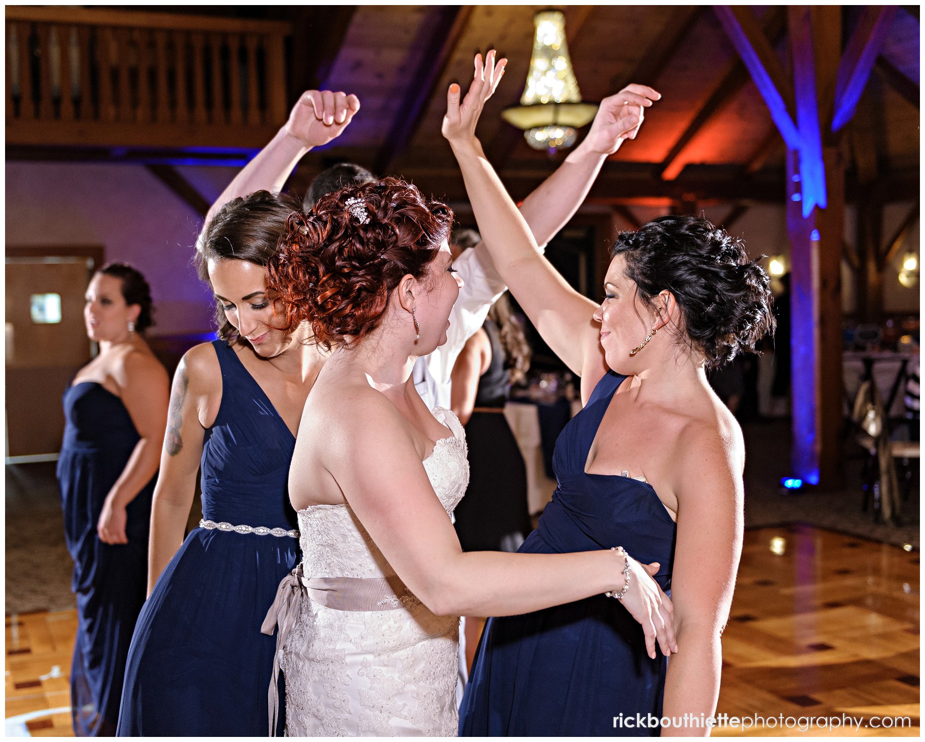 bride dancing with bridesmaid at Tewksbury Country Club