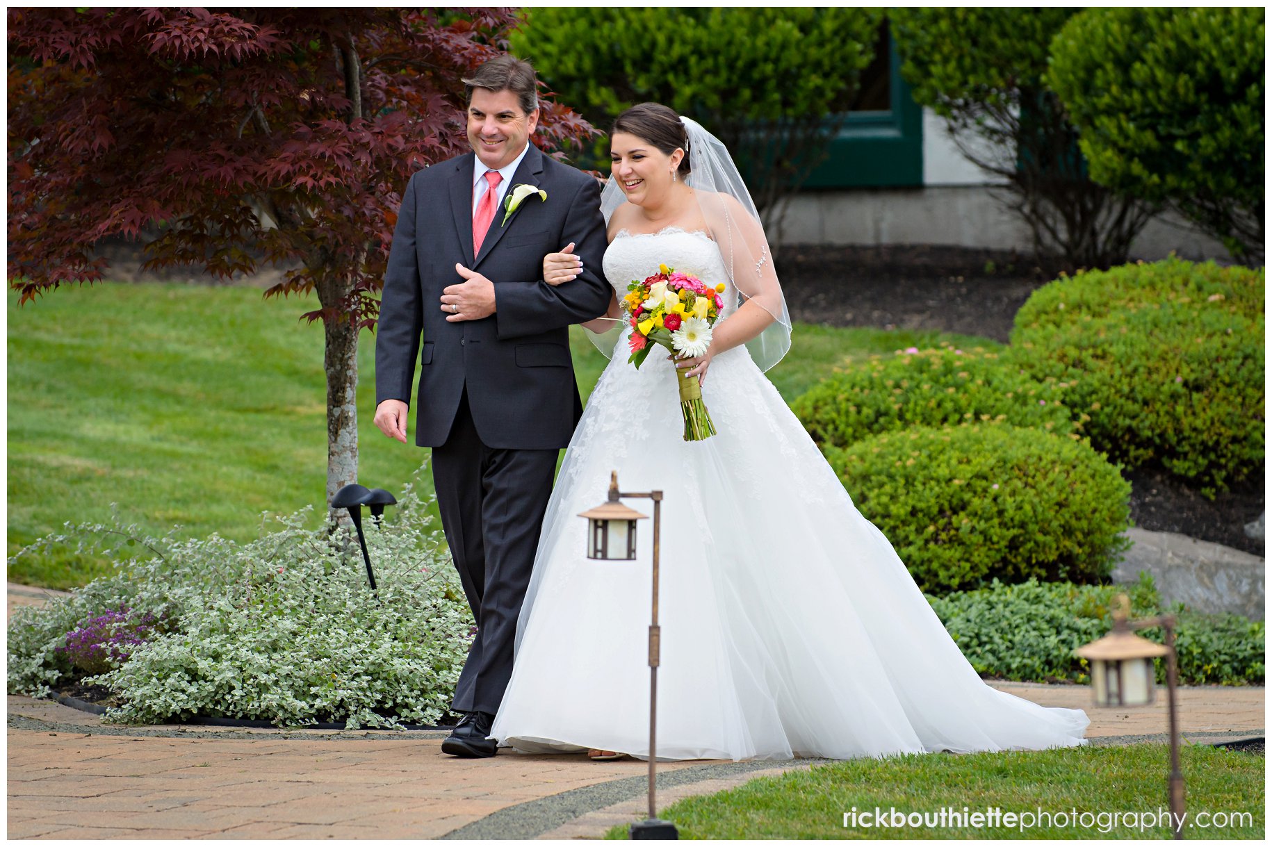 bride escorted by her father at wedding ceremony