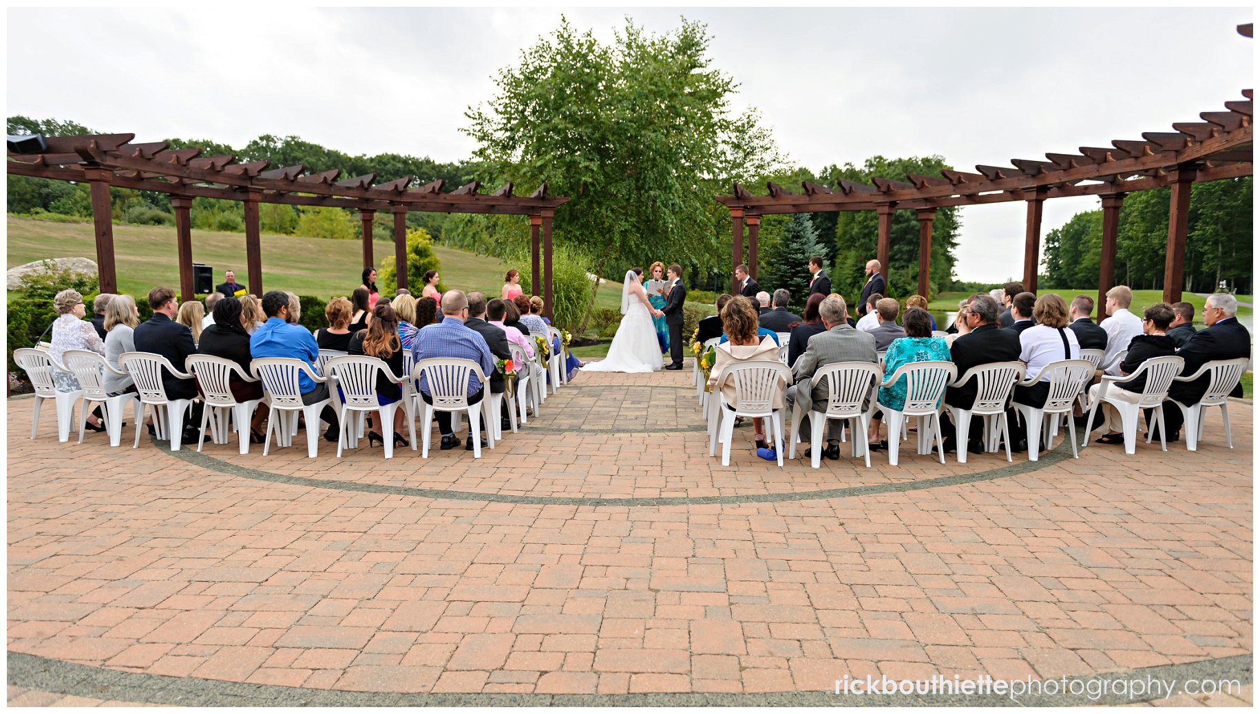 wedding ceremony on the grand terrace at atkinson country club wedding