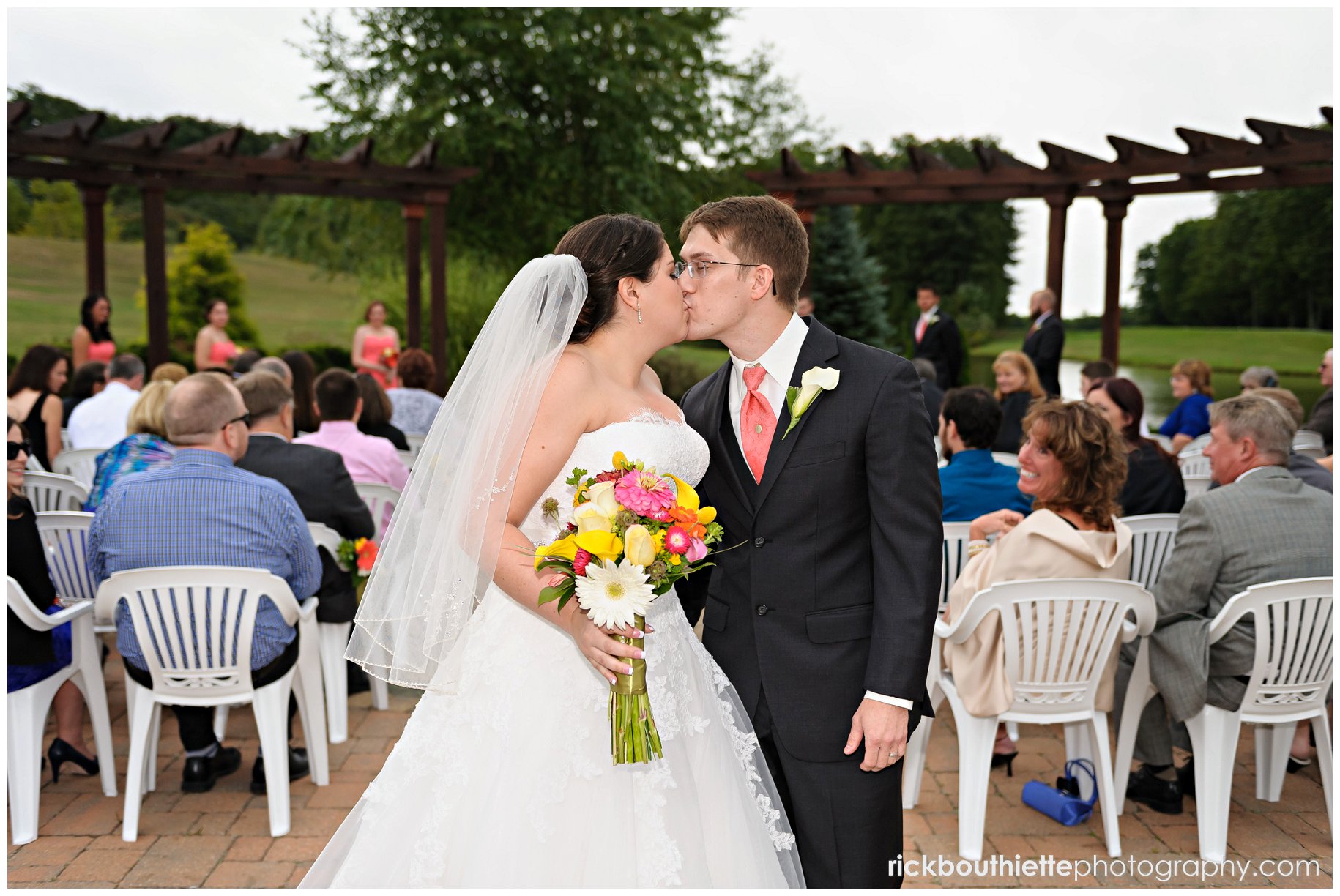 bride & groom kiss after wedding seremony