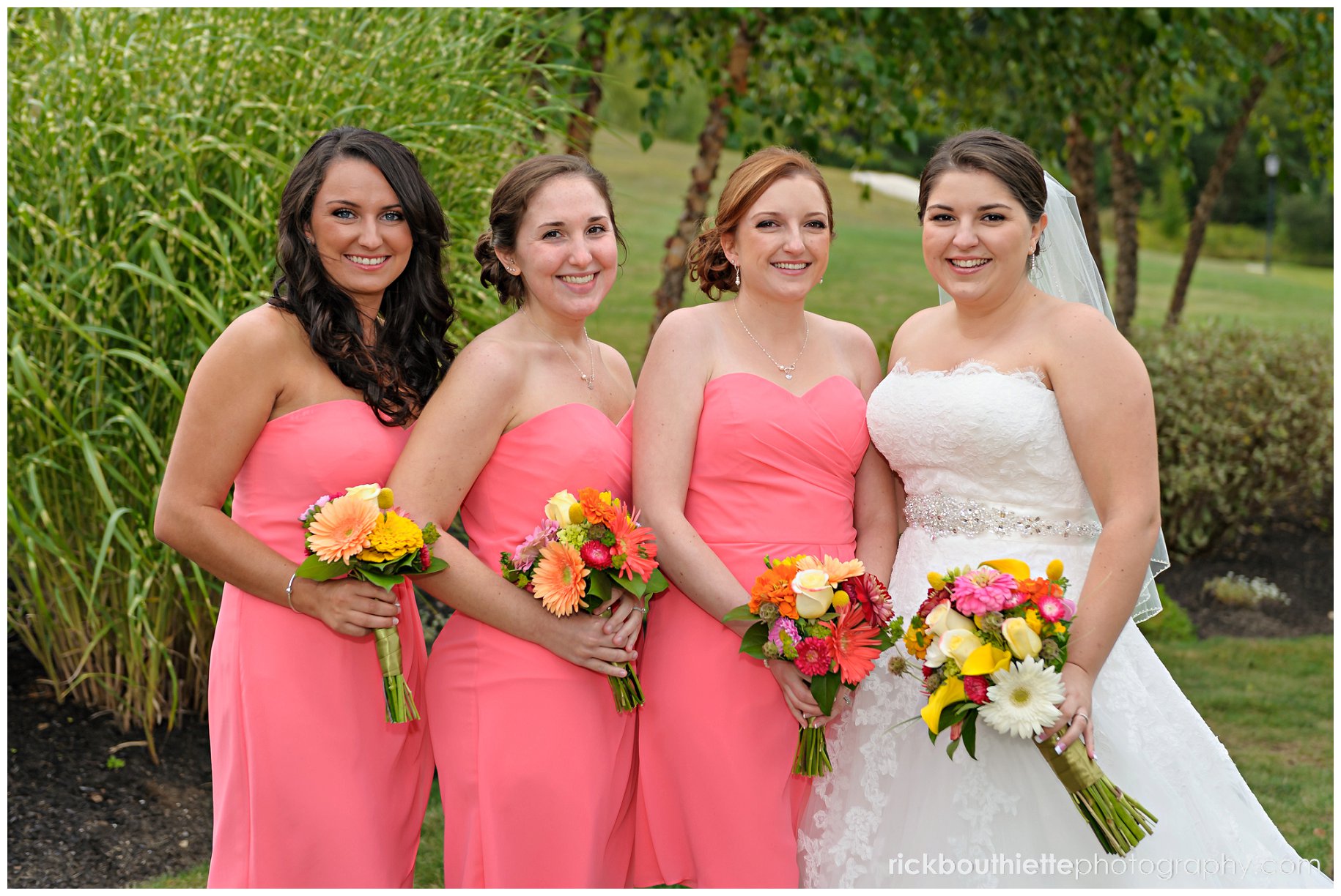 bride and bridesmaids at atkinson country club wedding