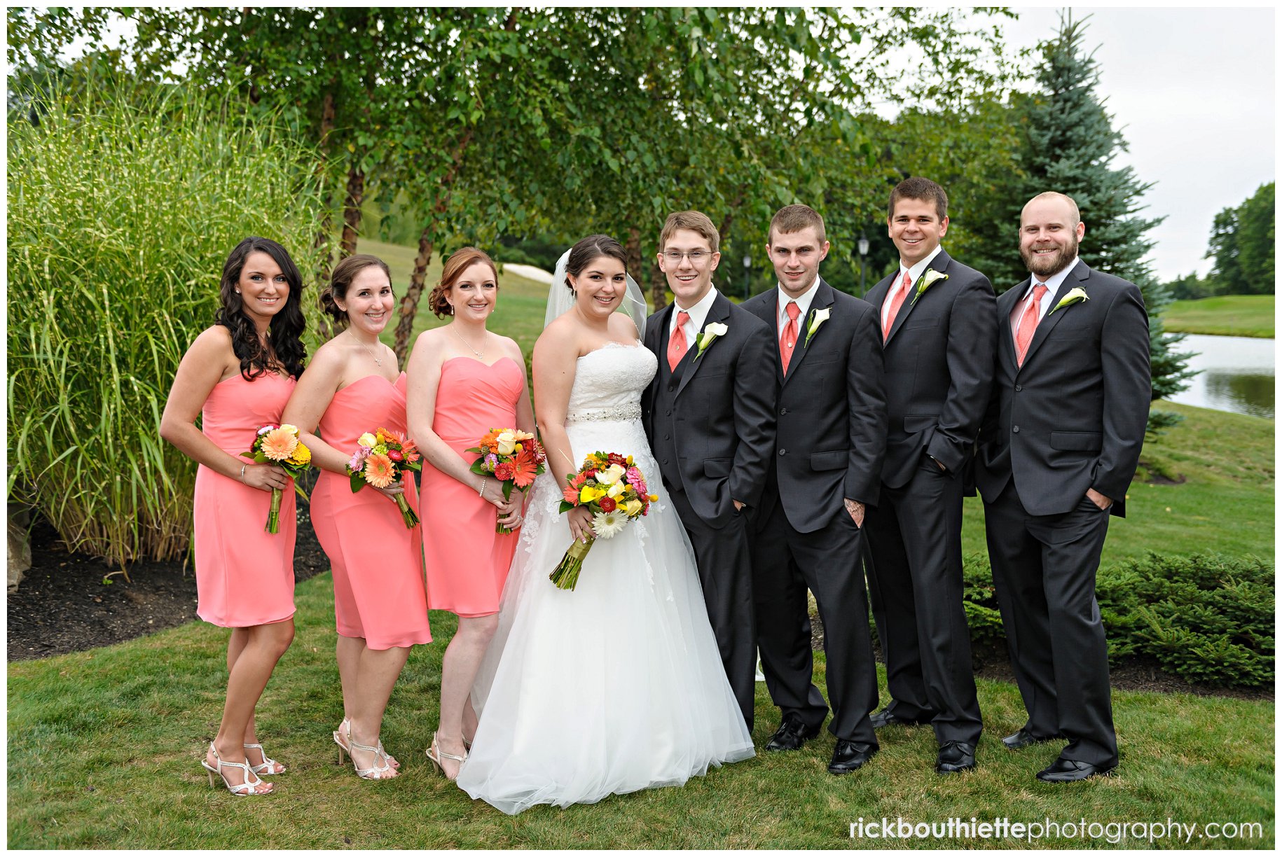 bride & groom with wedding party at atkinson country club