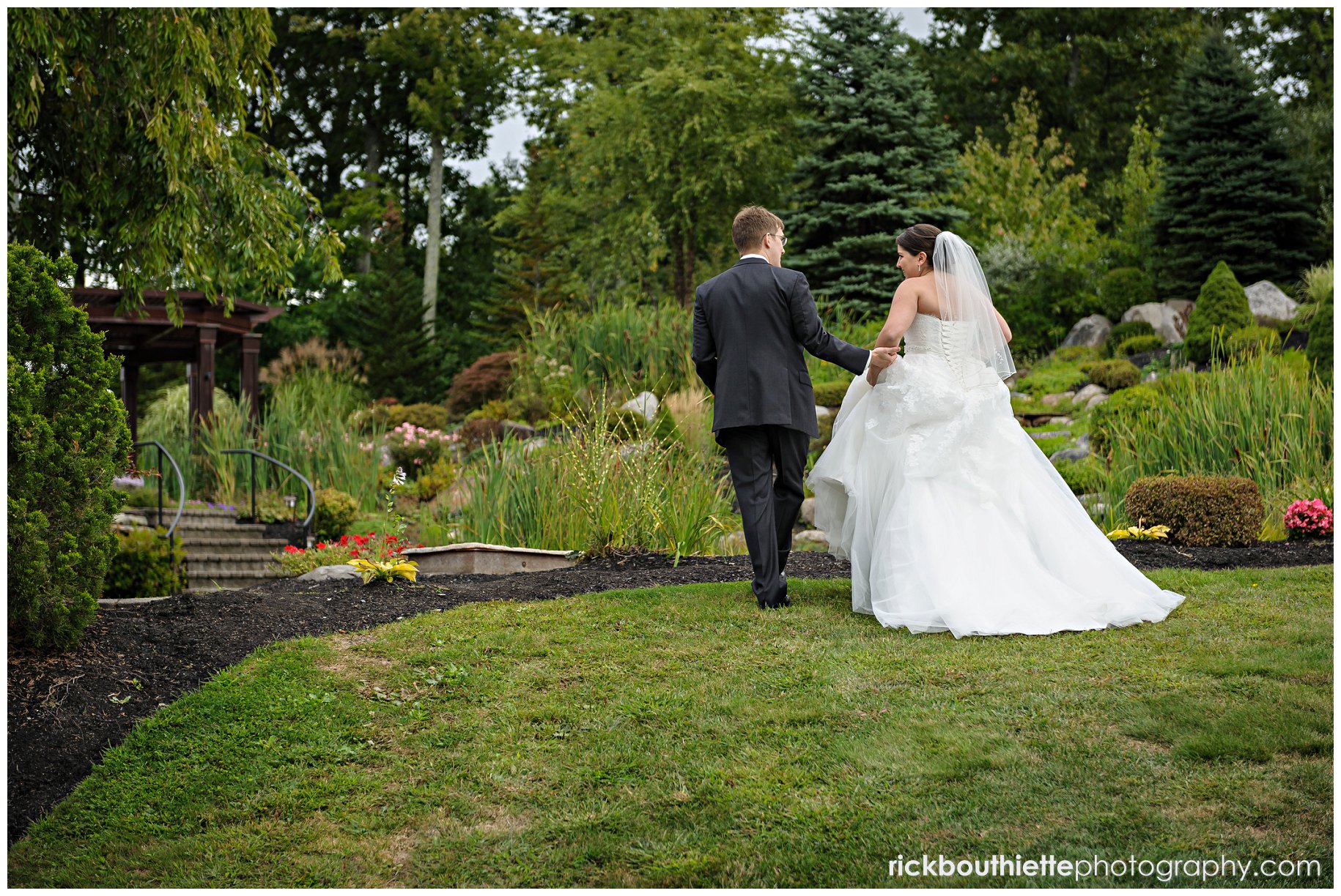 bride & groom walking at atkinson country club