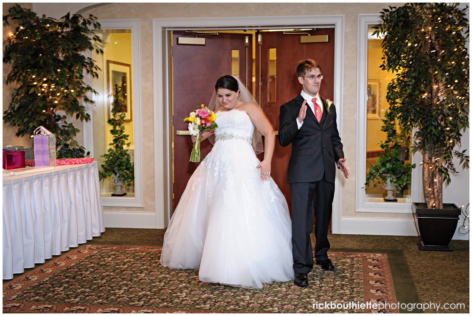 bride & groom enter wedding reception at atkinson country club