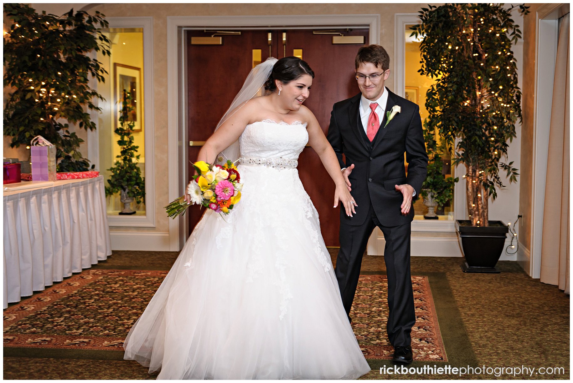 bride & groom enter wedding reception at atkinson country club