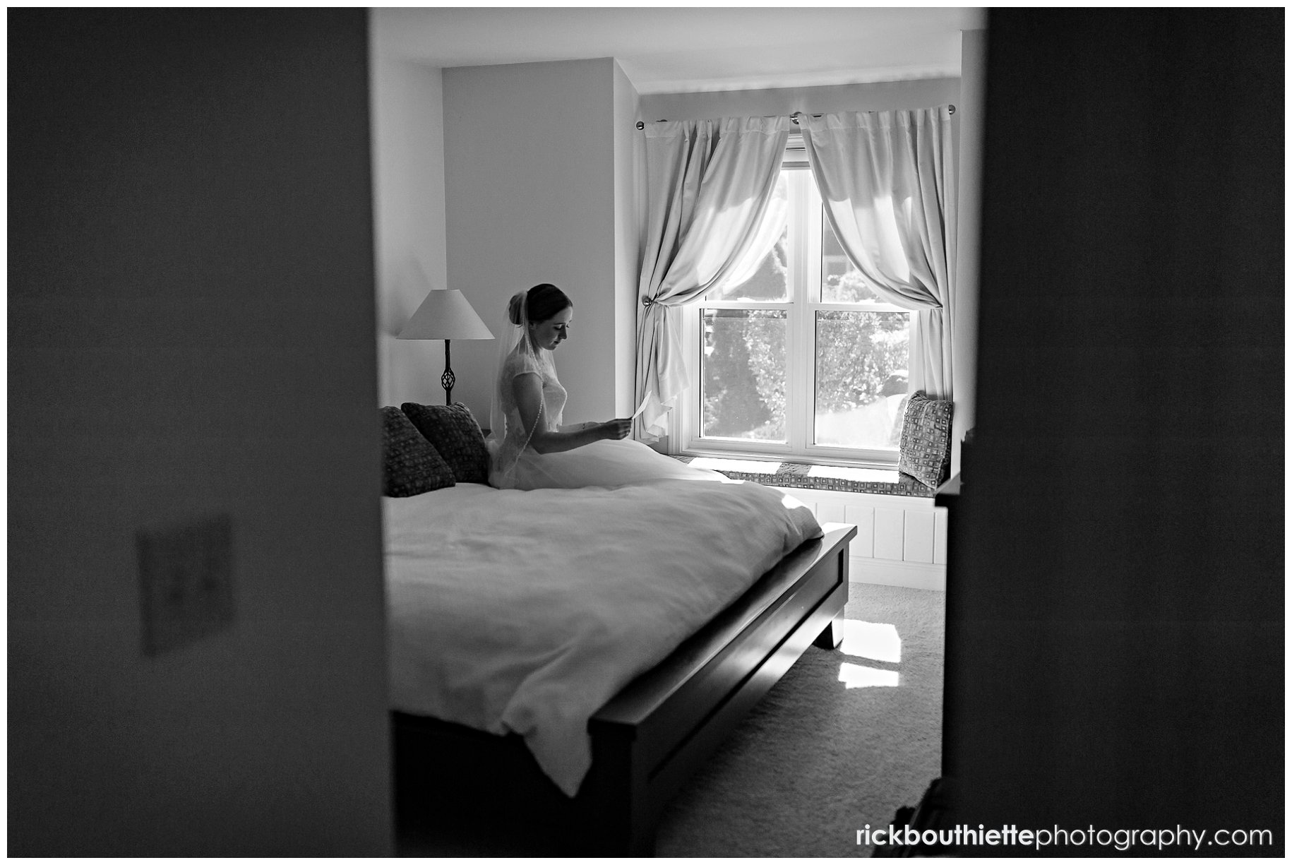 bride has a private moment alone in her room before her Indian Head Resort wedding