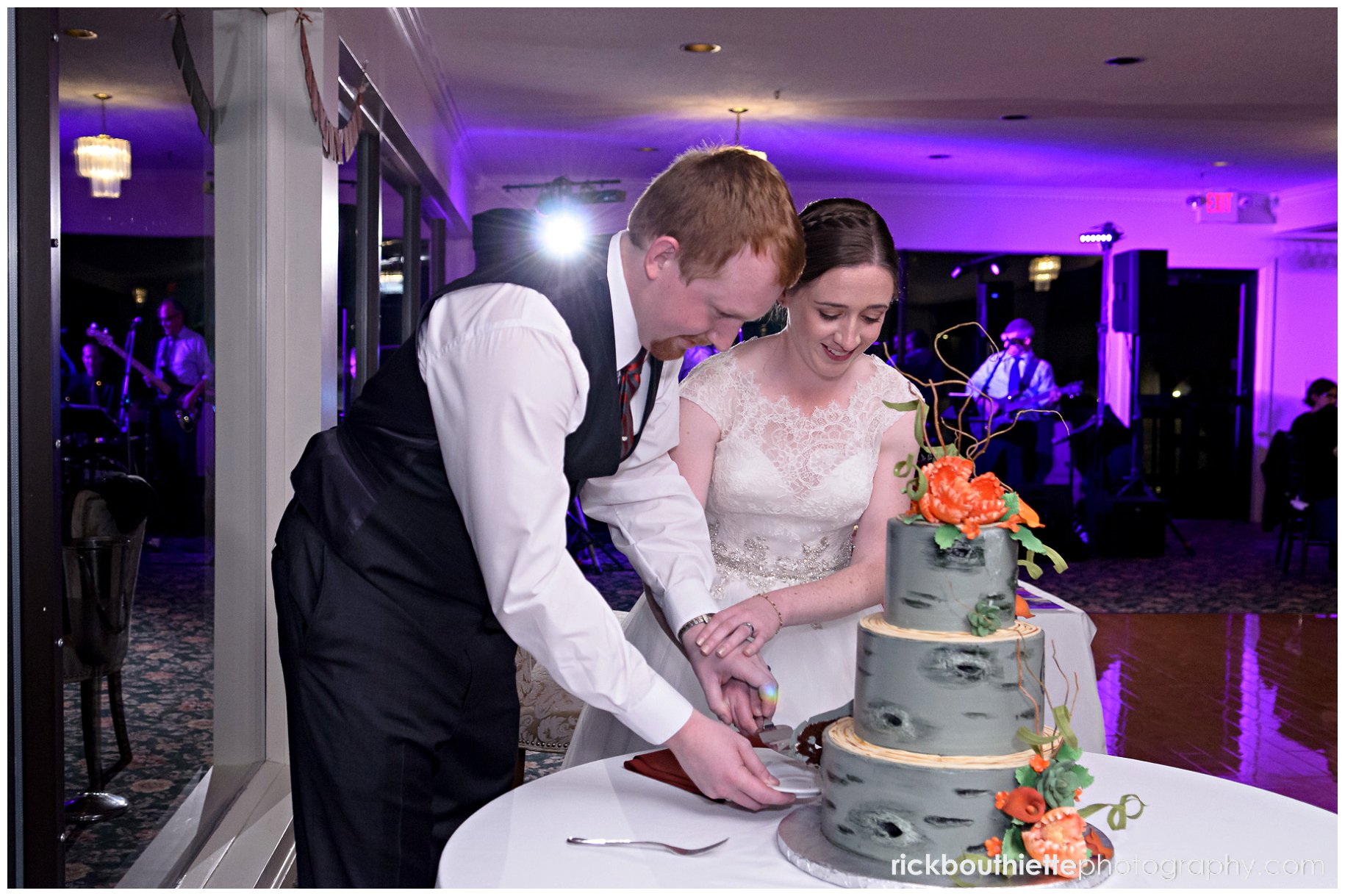 bride and groom cutting wedding cake at Indian Head Resort wedding