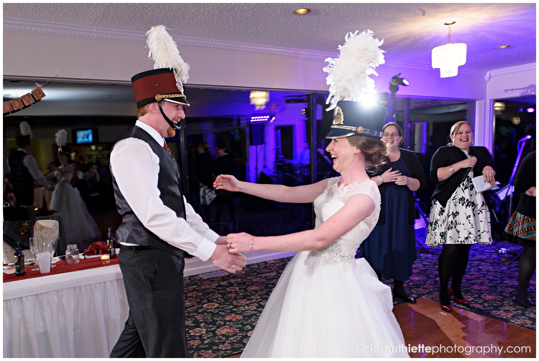 bride and groom with band hats on at Indian Head Resort wedding
