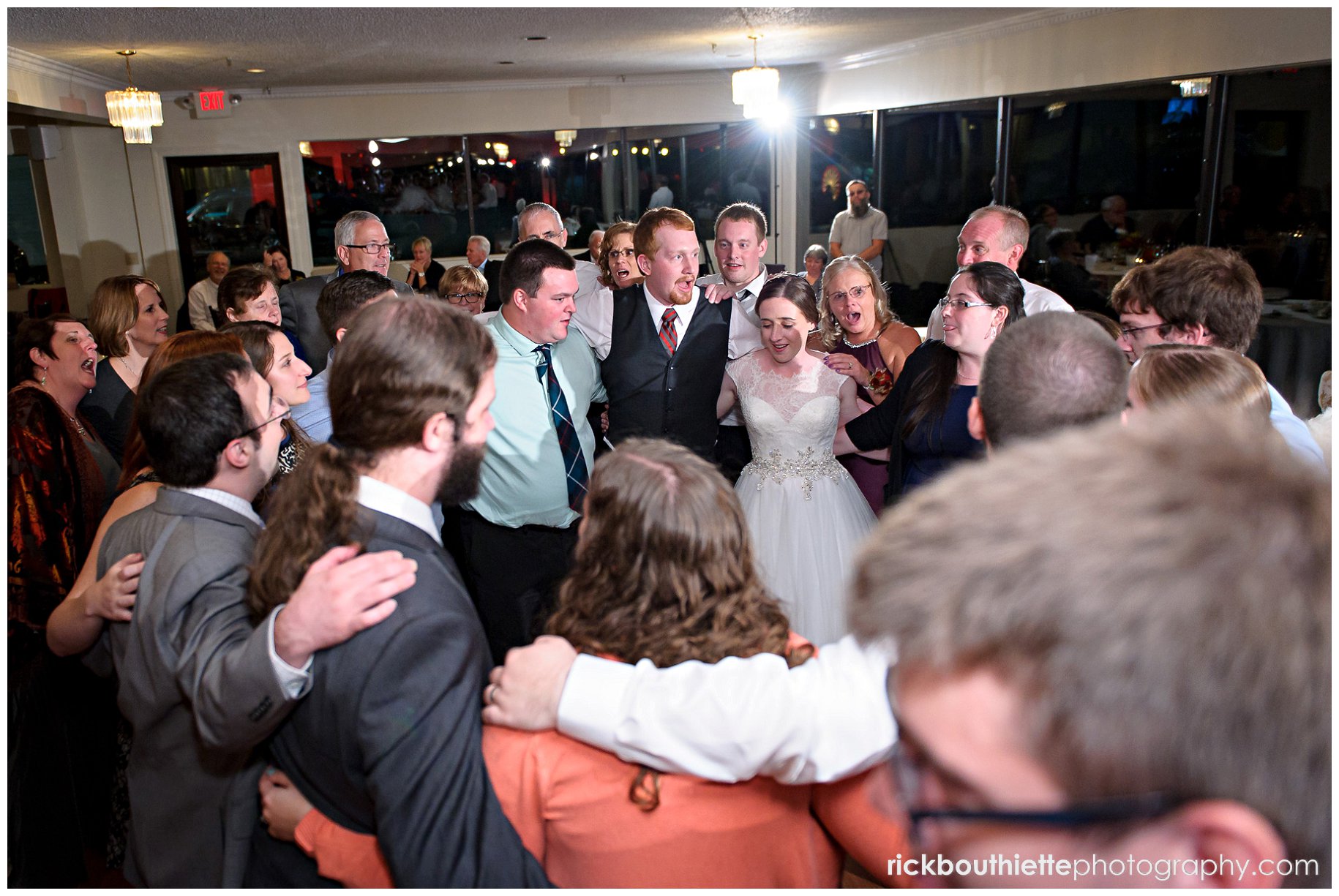 bride and groom dance with circle of friends at Indian Head Resort wedding