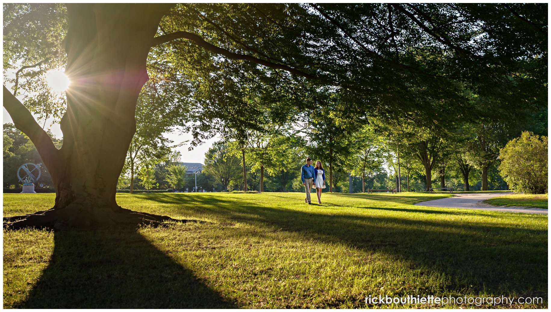 couple walking in the warm sunlight at their Phillips Academy engagement session