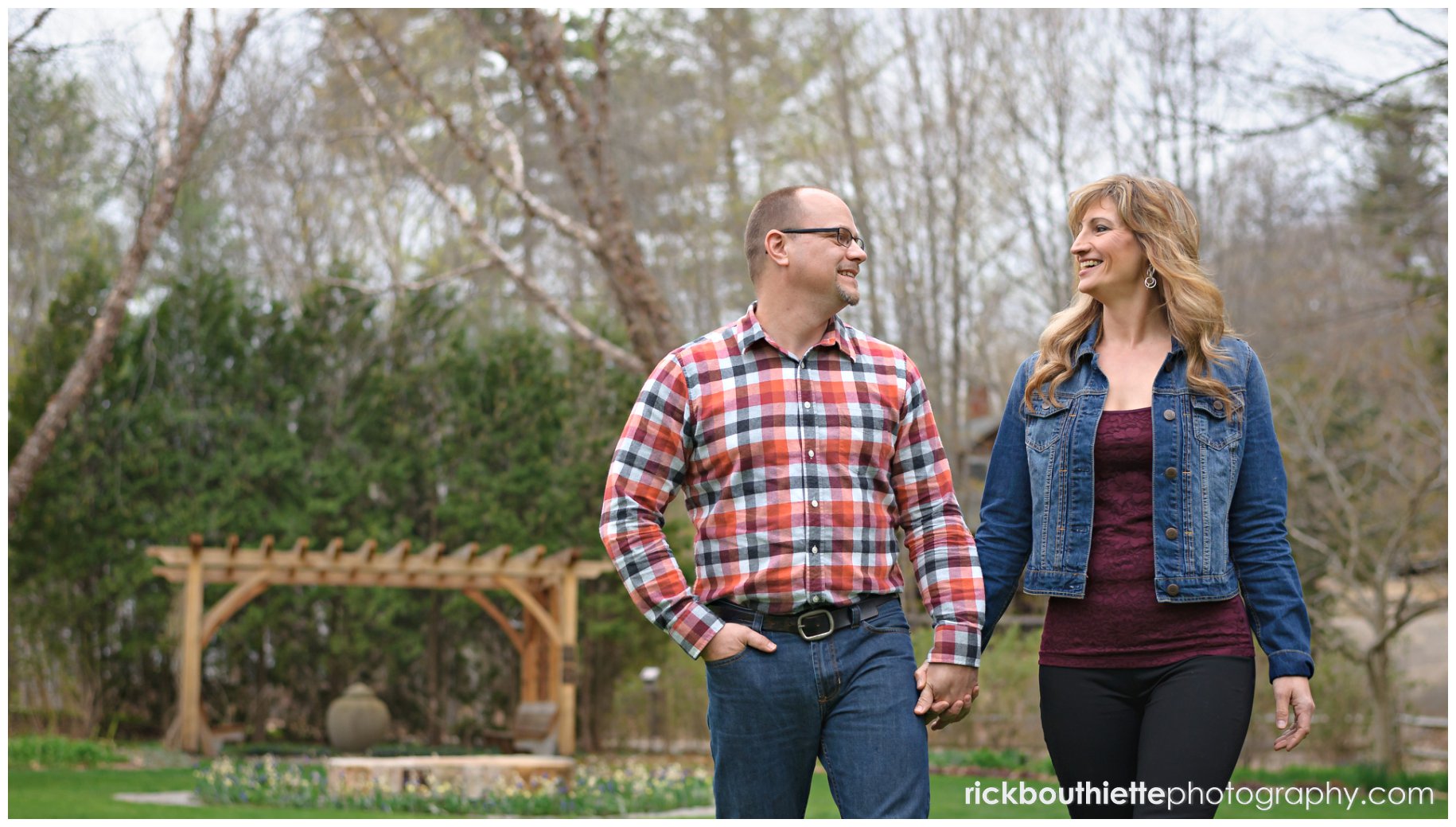 couple walking at Kirkwood Gardens during lakes region engagement photography