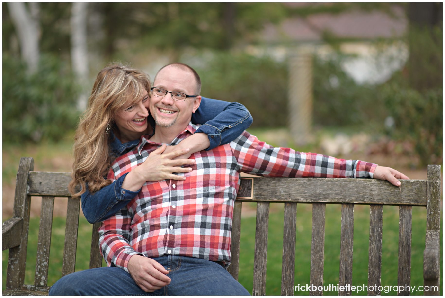 couple laughing during lakes region engagement photography