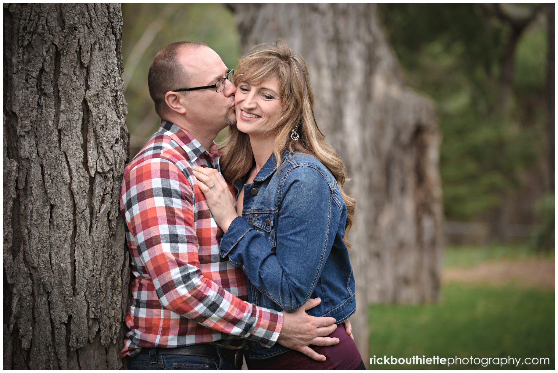 couple enjoying a romantic moment at Kirkwood Gardens during lakes region engagement photography