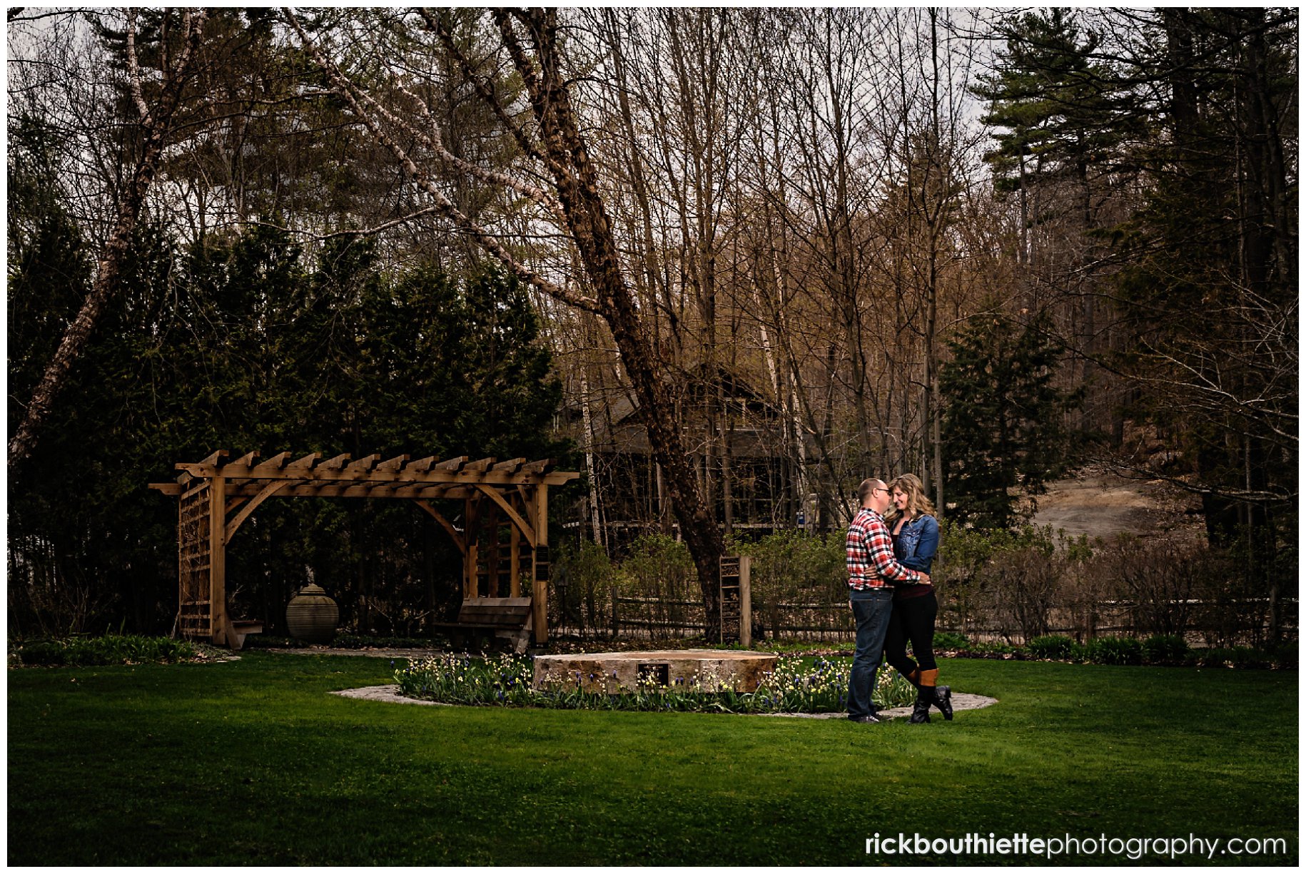 couple enjoying a romantic moment during lakes region engagement photography