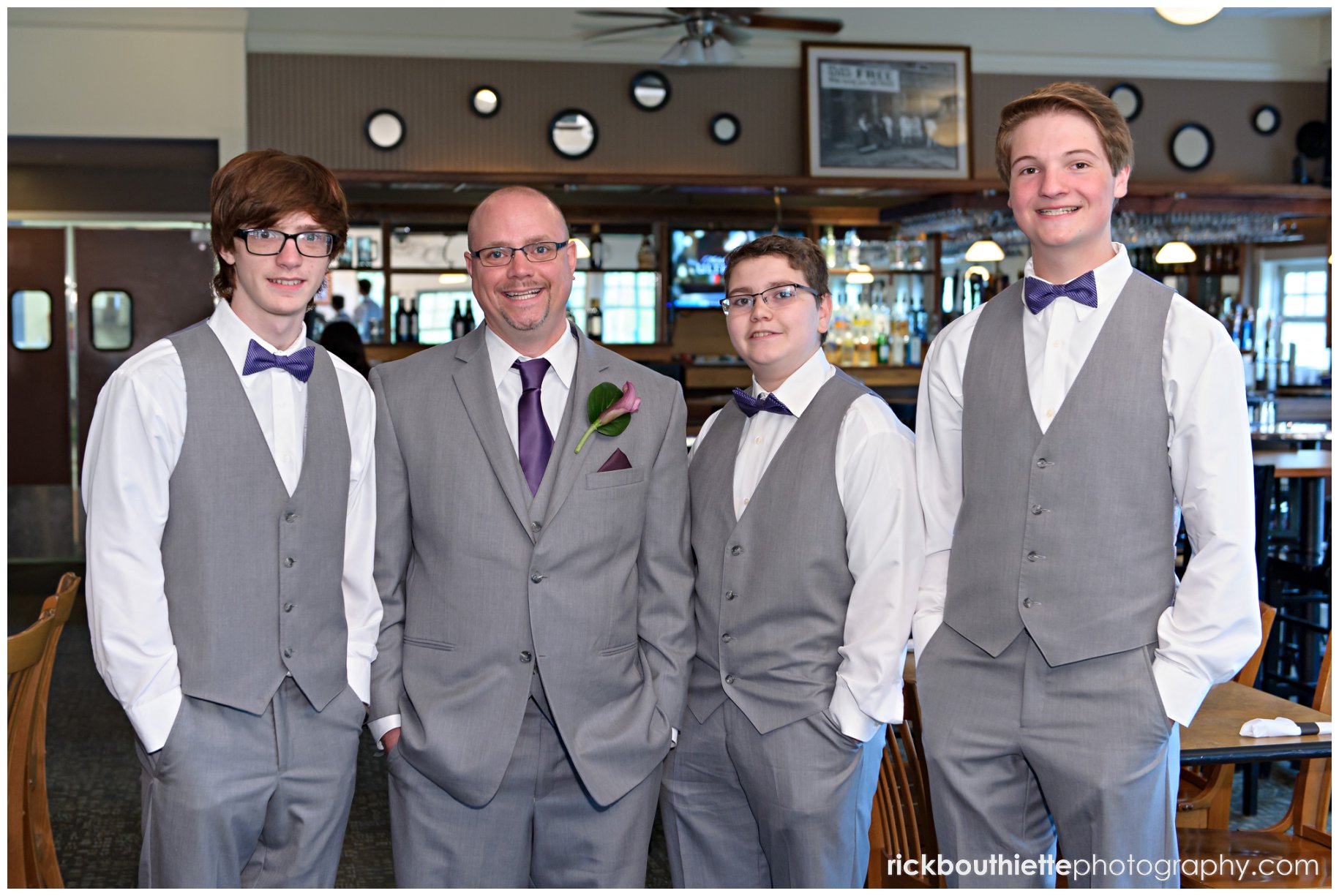 the groom and his groomsmen before his wedding at the Oaks Grandview Ballroom